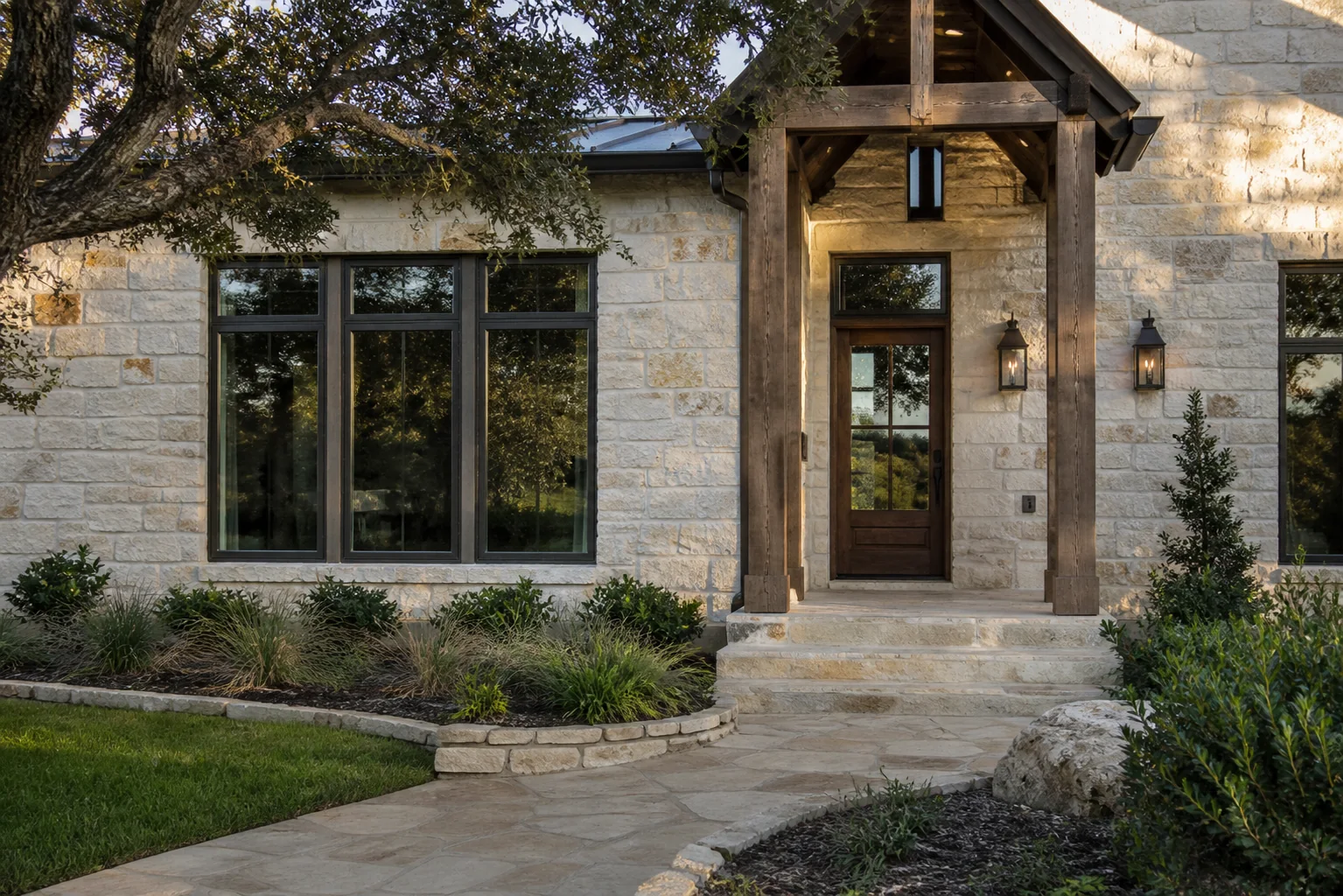 Tall residential windows set into a limestone Hill Country home